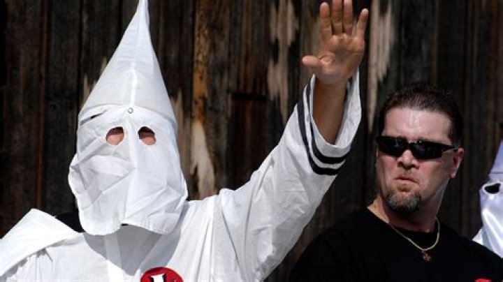 	KKK HIDES BEHIND MASK OF COWARDICE	