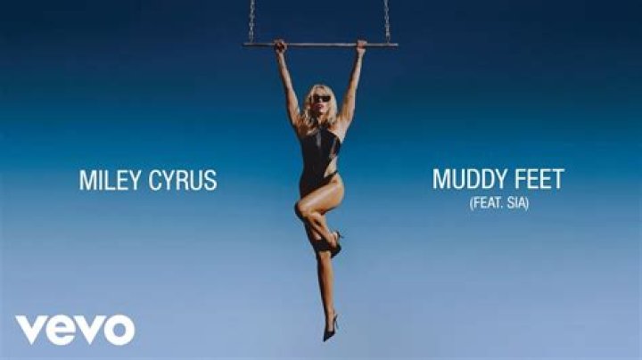 Naked, muddy Miley Cyrus hugs pigs; talks about attraction to girls