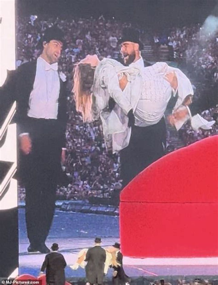 Travis Carrying Taylor: A Journey Of Support And Love