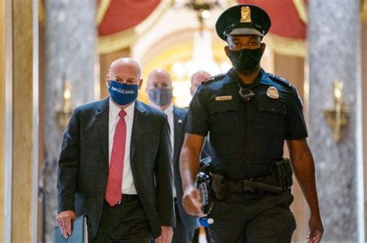 	Who is Postmaster General Louis DeJoy?	