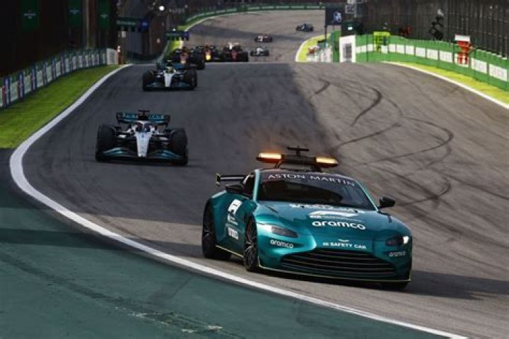 Why do drivers swerve in a zig-zag motion behind the safety car?